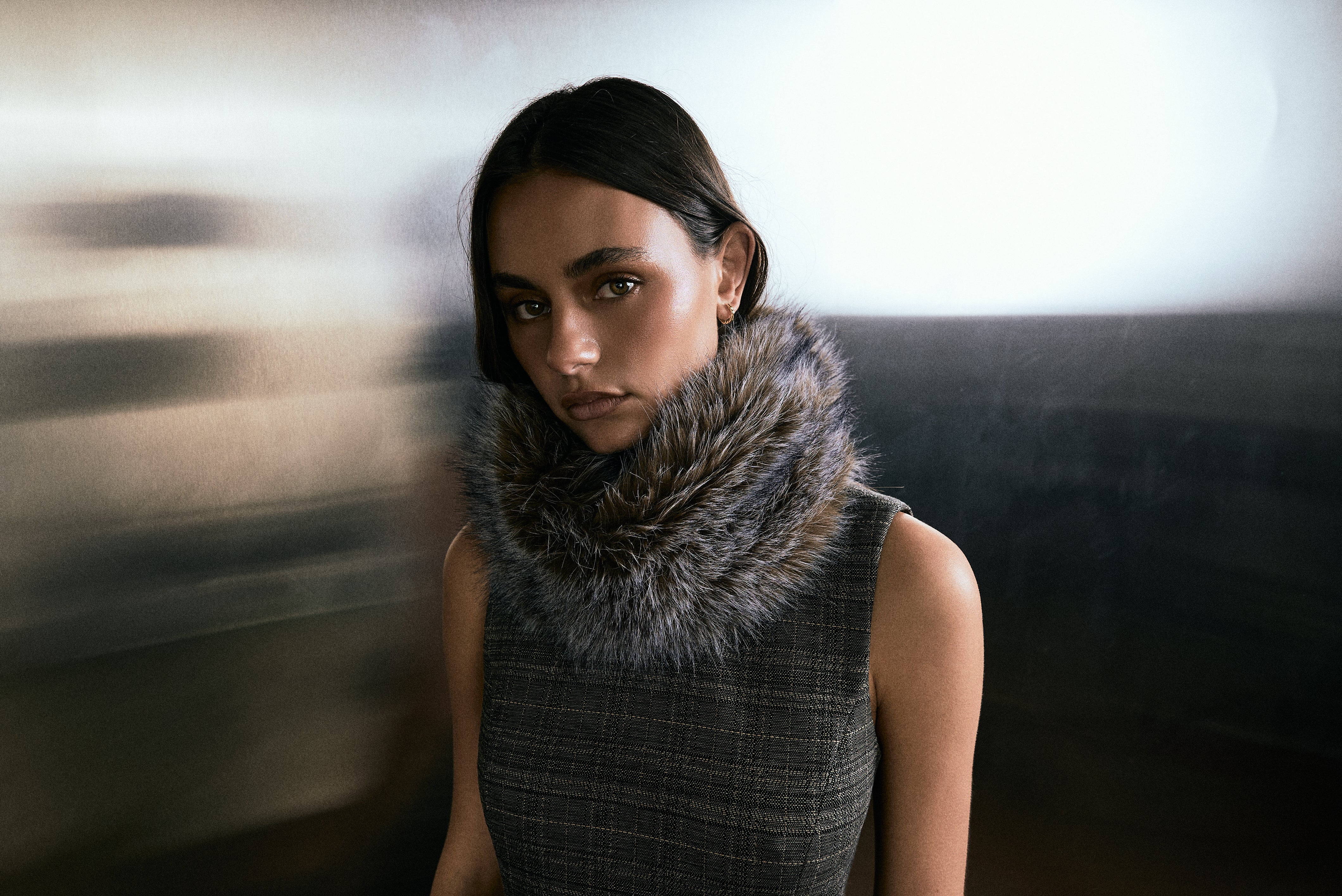 Deering — a close-up campaign portrait, fur-trimmed collar